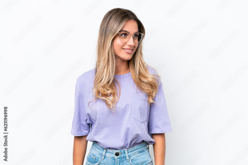 Young Uruguayan woman isolated on white background looking to the side Young Uruguayan woman isolated on white background looking to the side