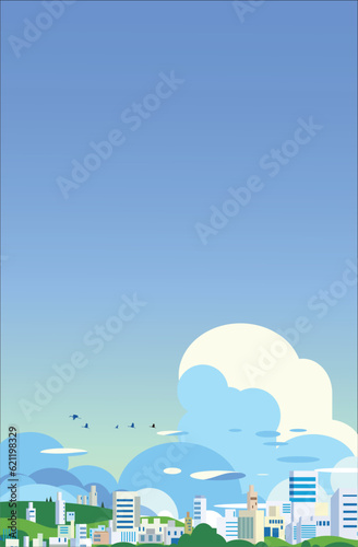 青空に入道雲が広がる夏の都市と市街地の風景