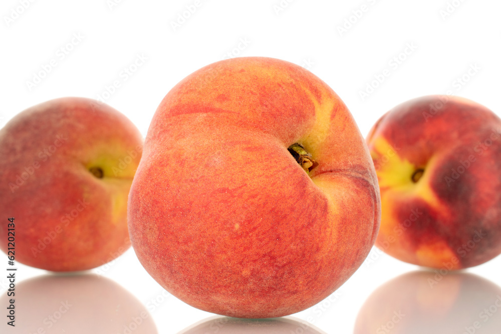 Three ripe organic peaches, macro, isolated on white background. Three ripe organic peaches, macro, isolated on white background.