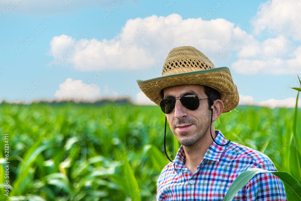 Man farmer checks corn field. Selective focus.