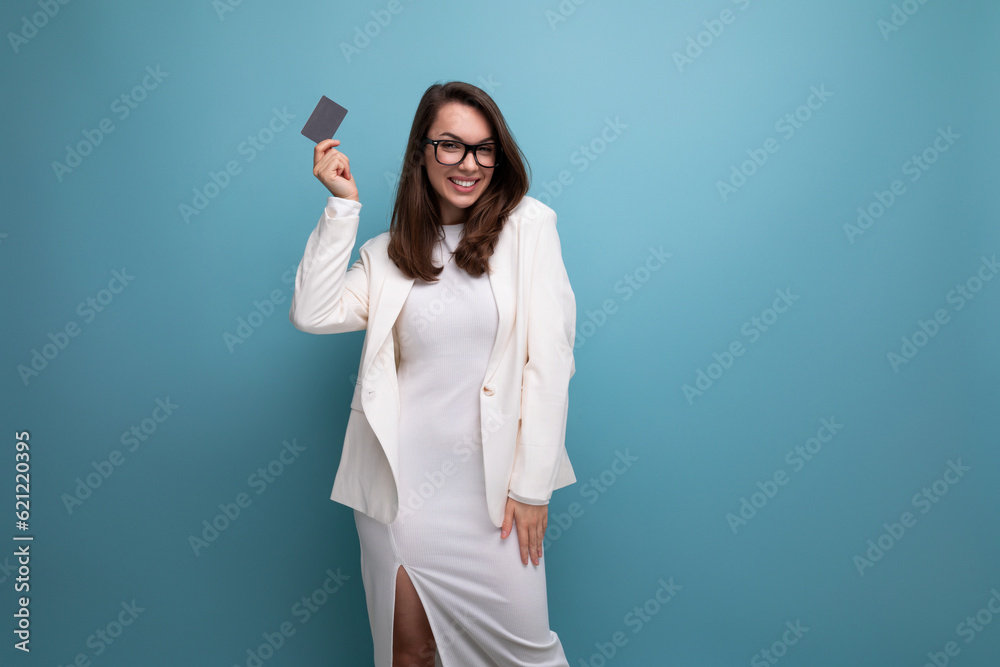 young brunette woman demonstrating credit card mockup young brunette woman demonstrating credit card mockup