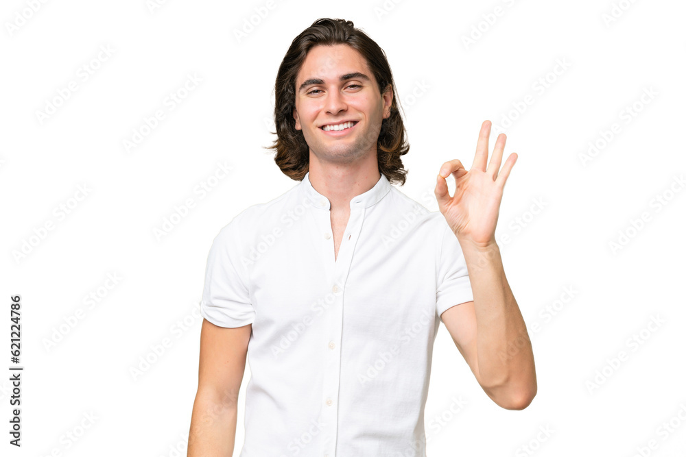Young caucasian man isolated on green chroma background showing ok sign with fingers Young caucasian man isolated on green chroma background showing ok sign with fingers