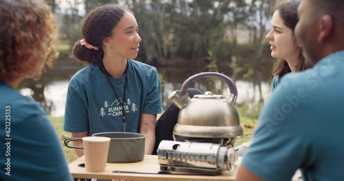 Volunteer, tea and a camp counselor group talking outdoor while planning at an outreach program for the community. Forest, nature or coffee with friends sitting outdoor in conversation about charity