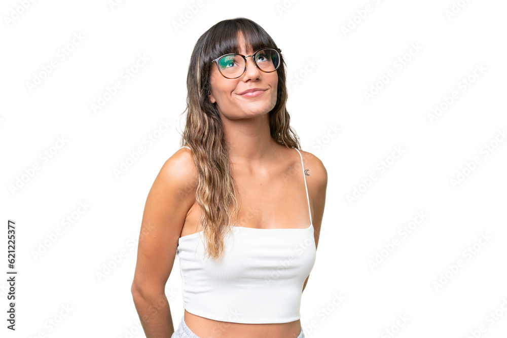 Young caucasian woman over isolated background and looking up