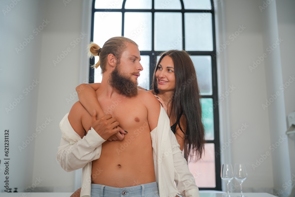 Sexy Young Couple. Young sexy hot couple in love hugging and kissing. Beautiful woman and handsome muscular man close to each other in erotic pose. Sexy Young Couple. Young sexy hot couple in love hugging and kissing. Beautiful woman and handsome muscular man close to each other in erotic pose.