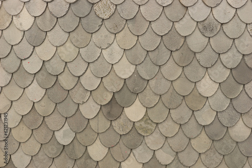Roof of a house made of gray shingles