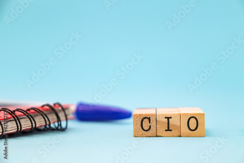cio letters on cubes on blue background. Chief Information Officer concept for business strategy and marketing