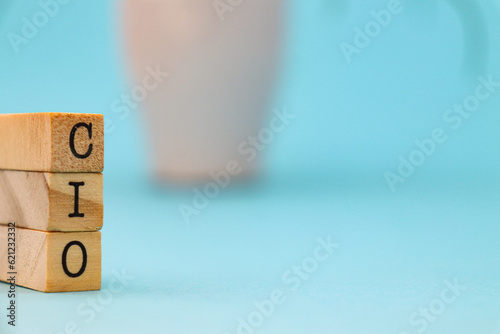cio letters on cubes on blue background. Chief Information Officer concept for business strategy and marketing