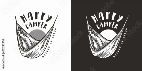 Man sits on a camping hammock in the forest. Adventure trip outdoor element