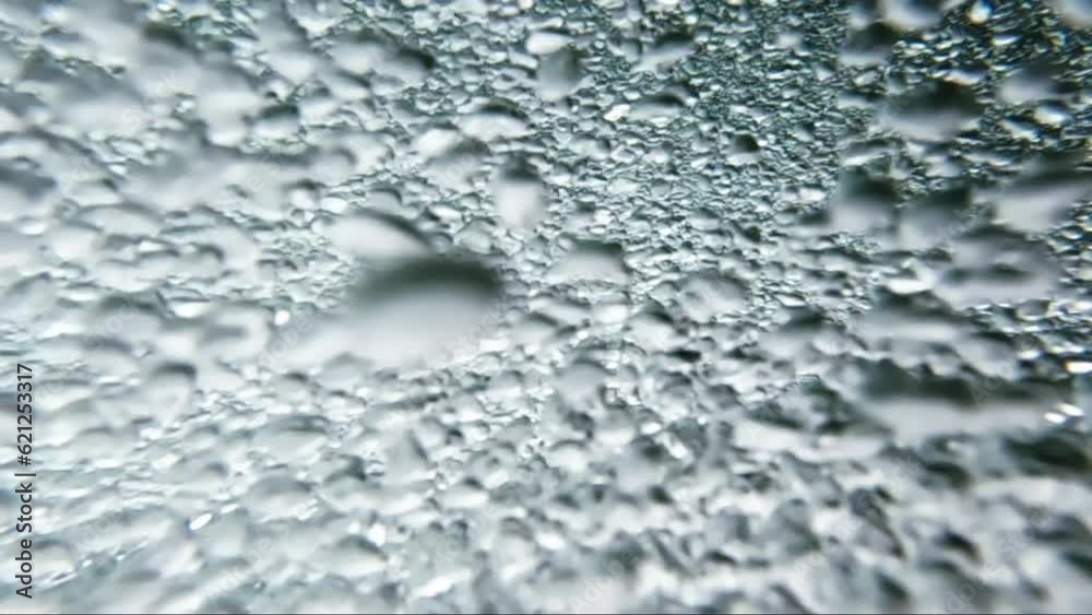 Abstract picture of air bubbles into the crystal clear water of a mountain stream with blurred spots of sun flare. Beauty in nature , underwater short, oxygen, ecology. Abstract picture of air bubbles into the crystal clear water of a mountain stream with blurred spots of sun flare. Beauty in nature , underwater short, oxygen, ecology.