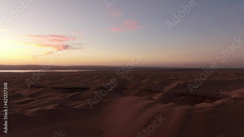 aerial view traveling in and at sunset over the Shahara desert photo