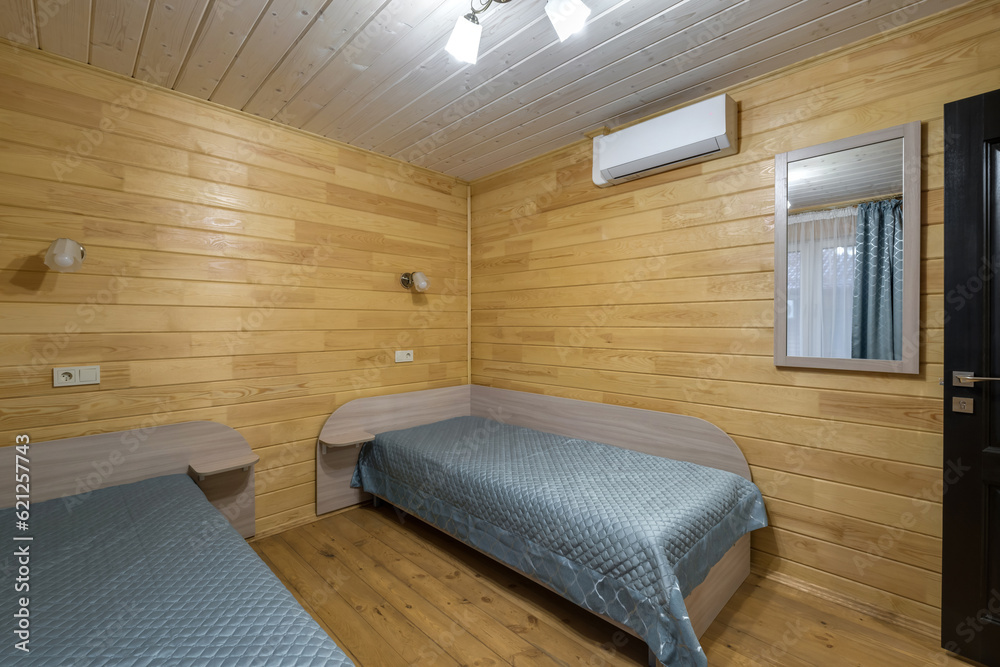 Naklejka premium interior of wooden eco bedroom in studio apartments, hostel or homestead
