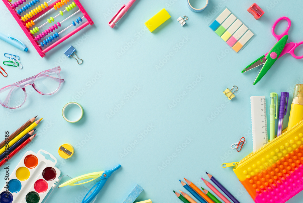 Immerse yourself in the world of early education with this captivating top-down image: an array of vibrant school supplies on a pastel blue backdrop, offering ample round frame for text or advertising Immerse yourself in the world of early education with this captivating top-down image: an array of vibrant school supplies on a pastel blue backdrop, offering ample round frame for text or advertising