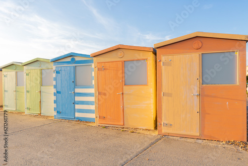Colourful beach huts in a row. Seaford, East Sussex © Falk