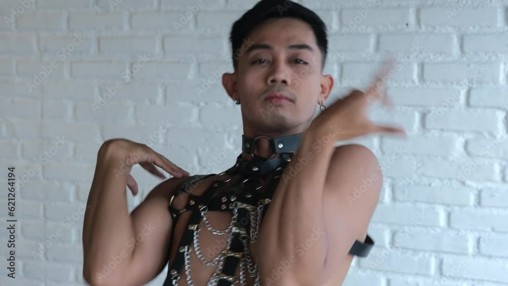 asian-guy-in-bdsm-costume-dancing-vogue-a-handsome-transgender-guy-in