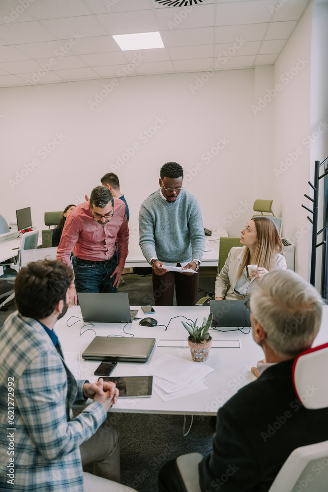 Office employee directing the attention towards him Office employee directing the attention towards him