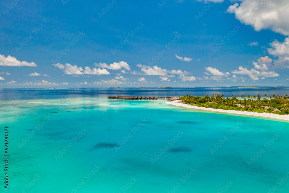 Beautiful amazing Maldives paradise. Fantastic tropical aerial travel landscape, seascape. Luxury water villas bungalows. Dream vacation, best destination aerial drone beach view. Palm trees sea sky