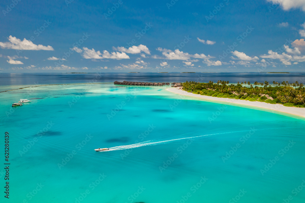 Beautiful amazing Maldives paradise. Fantastic tropical aerial travel landscape sail boat. Luxury water villas bungalows. Dream vacation, best destination aerial drone beach view. Palm trees sea sky