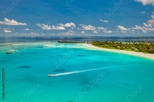 Beautiful amazing Maldives paradise. Fantastic tropical aerial travel landscape sail boat. Luxury water villas bungalows. Dream vacation, best destination aerial drone beach view. Palm trees sea sky © icemanphotos