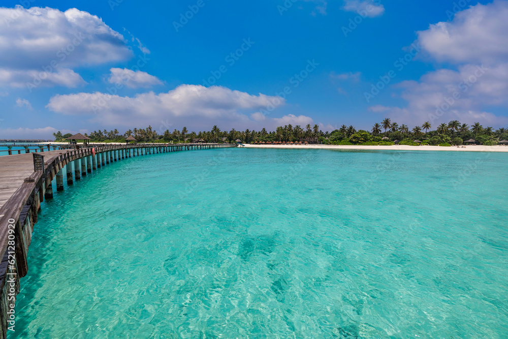 Best travel landscape. Exotic island sea bay wooden pier over pristine lagoon leads into beautiful tropical paradise, coco palm trees white sand. Calm water, sunshine. Amazing vacation, luxury resort