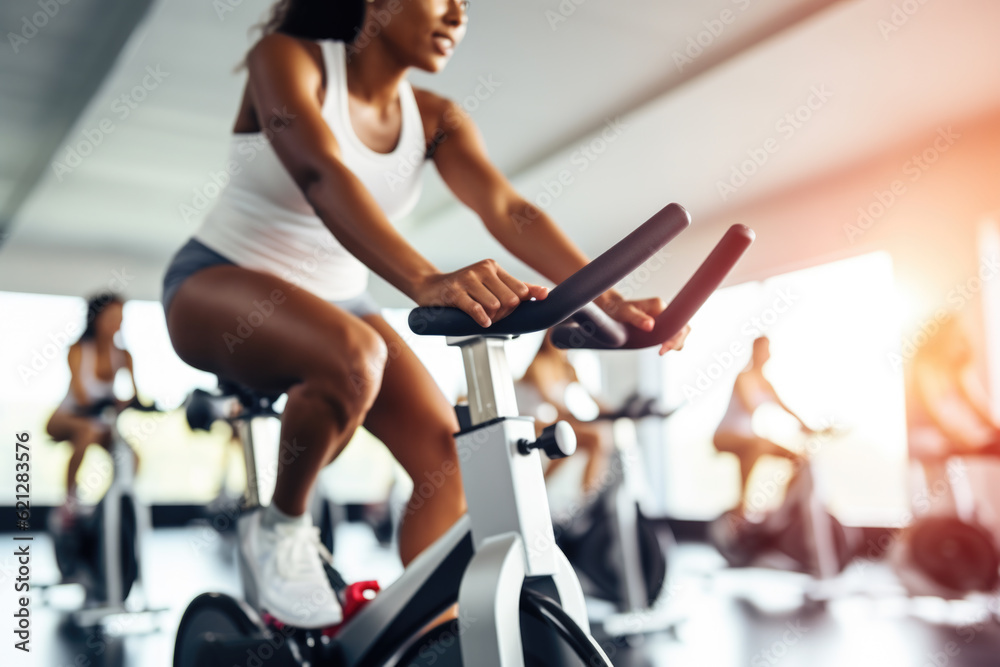 Group fitness class , featuring participants engaged in an energetic workout, such as spinning, aerobics, set against a bright, gym studio background Group fitness class , featuring participants engaged in an energetic workout, such as spinning, aerobics, set against a bright, gym studio background