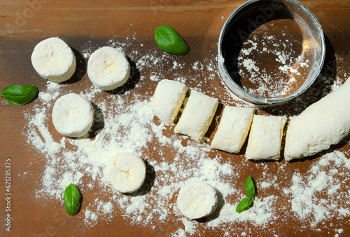 Cheesecakes and melissa mint leaves on a wooden board. Delicious grainy homemade cottage cheese. photo