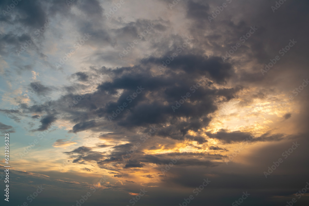 Magical dramatic sky with clouds and sunset light.