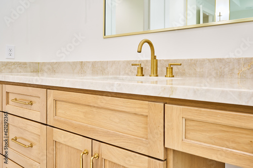 Bathroom vanity sink with wood cabinetry