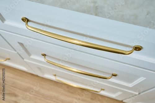 Looking Down at Gold Cabinet Drawer Hardware