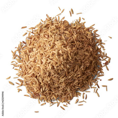 pile of paddy husk or rice husk, aka yellow rice chaff, rice husk or rice hull, outermost layer of the rice grain to use as animal feed, isolated background, taken from above