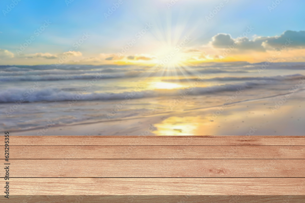 Empty wooden table top or counter and sun, sunlight blur bokeh of beach sand sea nature background. Summer holiday travel for Template mock up display montages product. Wood table plank background