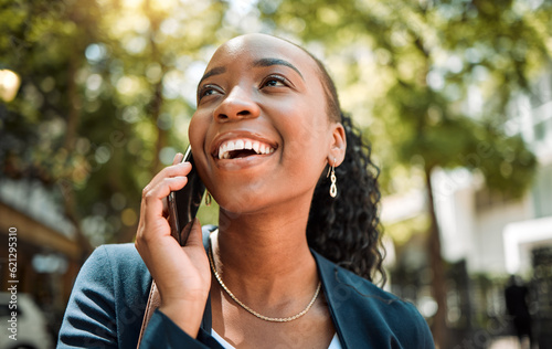 Happy, thinking and a black woman on a phone call in the city for communication, networking and chat. Smile, ideas and an African employee speaking on a mobile in town for work, planning or contact