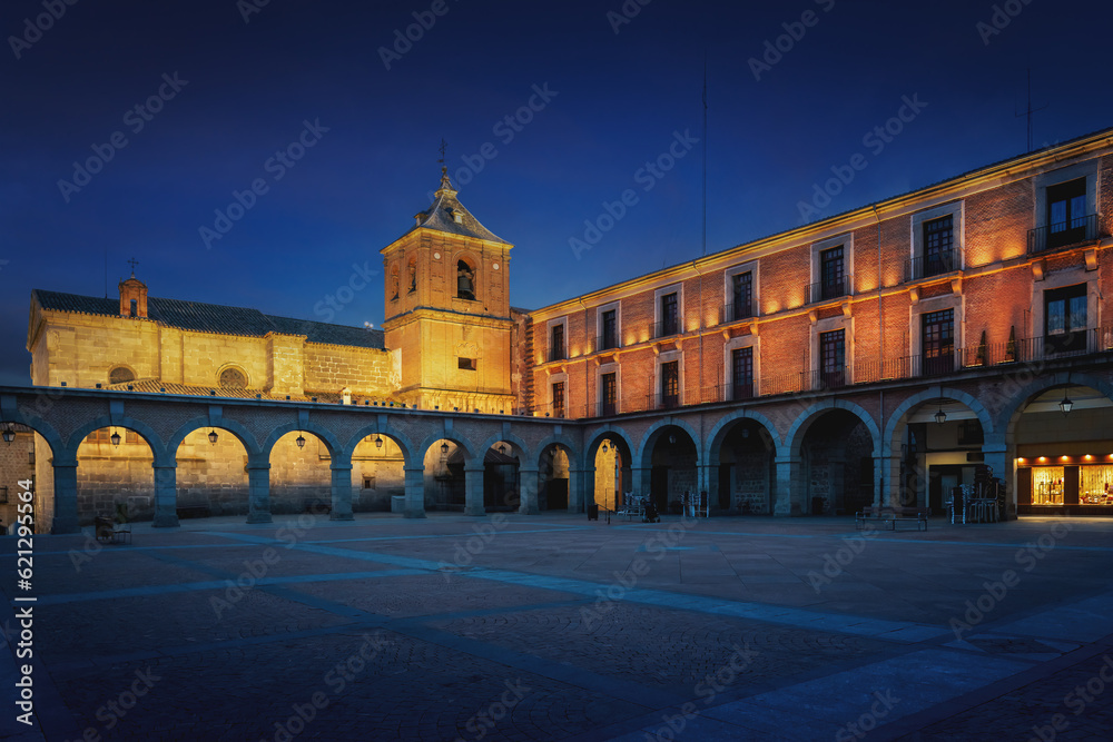 Plaza del Mercado Chico Square with Church of Saint John Baptist (San Juan Bautista) at night - Avila, Spain