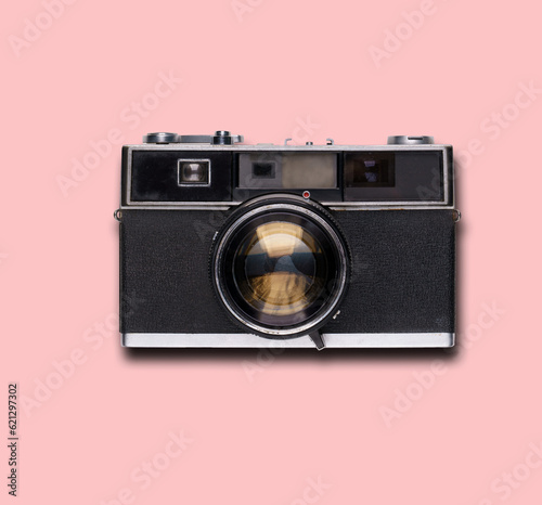 vintage old film camera on pink background