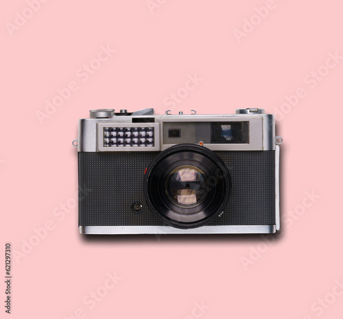 vintage old film camera on pink background