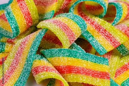 Wallpaper Mural Colorful jelly candies strips in sugar sprinkles. Sour flavored rainbow candy background. Torontodigital.ca