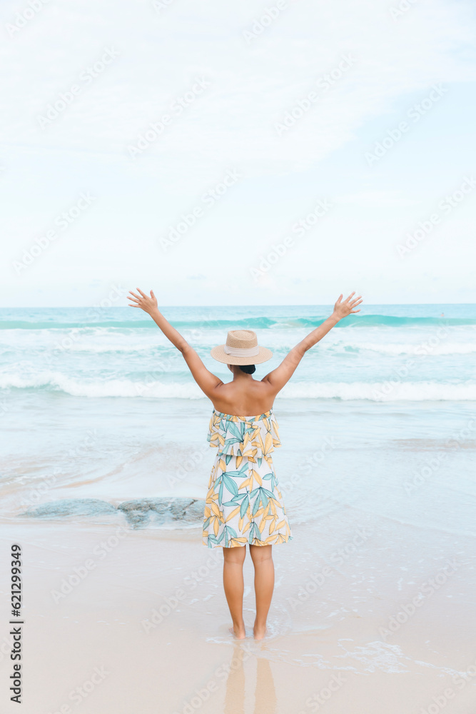 A happy woman embraces her wanderlust on the beach, basking in the sun's warm embrace and discovering the beauty of the coastal paradise. A happy woman embraces her wanderlust on the beach, basking in the sun's warm embrace and discovering the beauty of the coastal paradise.