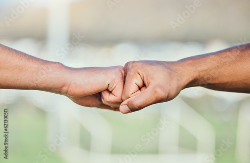 Soccer, fist bump and hands for teamwork, support and sports for training at stadium outdoor. Collaboration, together and football players with motivation for exercise target, workout goal or success