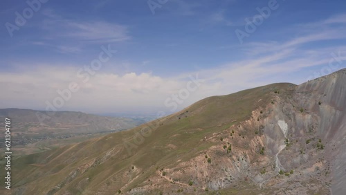 Panoramic view of hills, mountain meadows and sandy scree. Aerial view, Kyrgyzstan, foothills of the Tien Shan Mountains