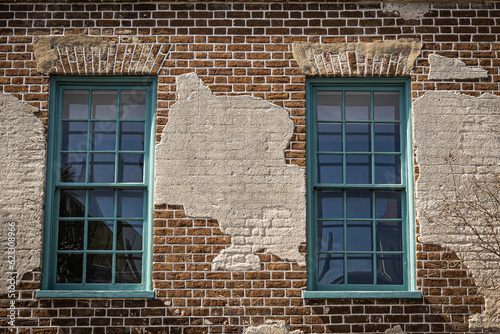 Close up of the color windows of a colonial era home in Charleston, South Carolina