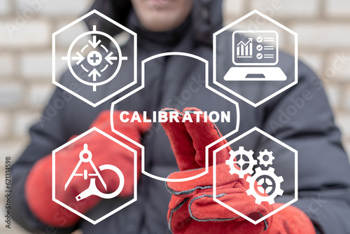 Engineer using virtual touch screen presses word: CALIBRATION. Concept of activate calibration, intermediate check or calibration measurement. Industrial calibration operations.