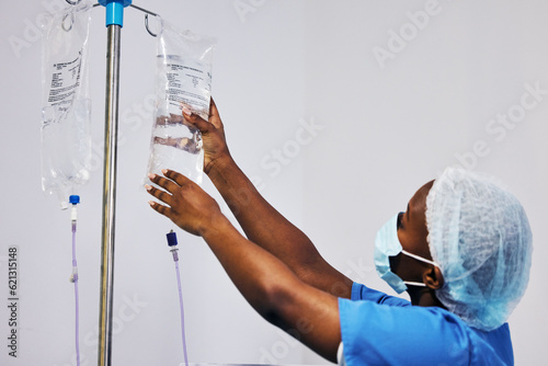 Slika na platnu Hospital, nurse with face mask and black woman with iv drip medicine, fluid infusion or liquid injection bag
