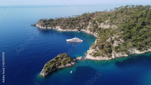 Drone aerial view of luxury private yacht in the mediterranean azure sea at sunny summer day
