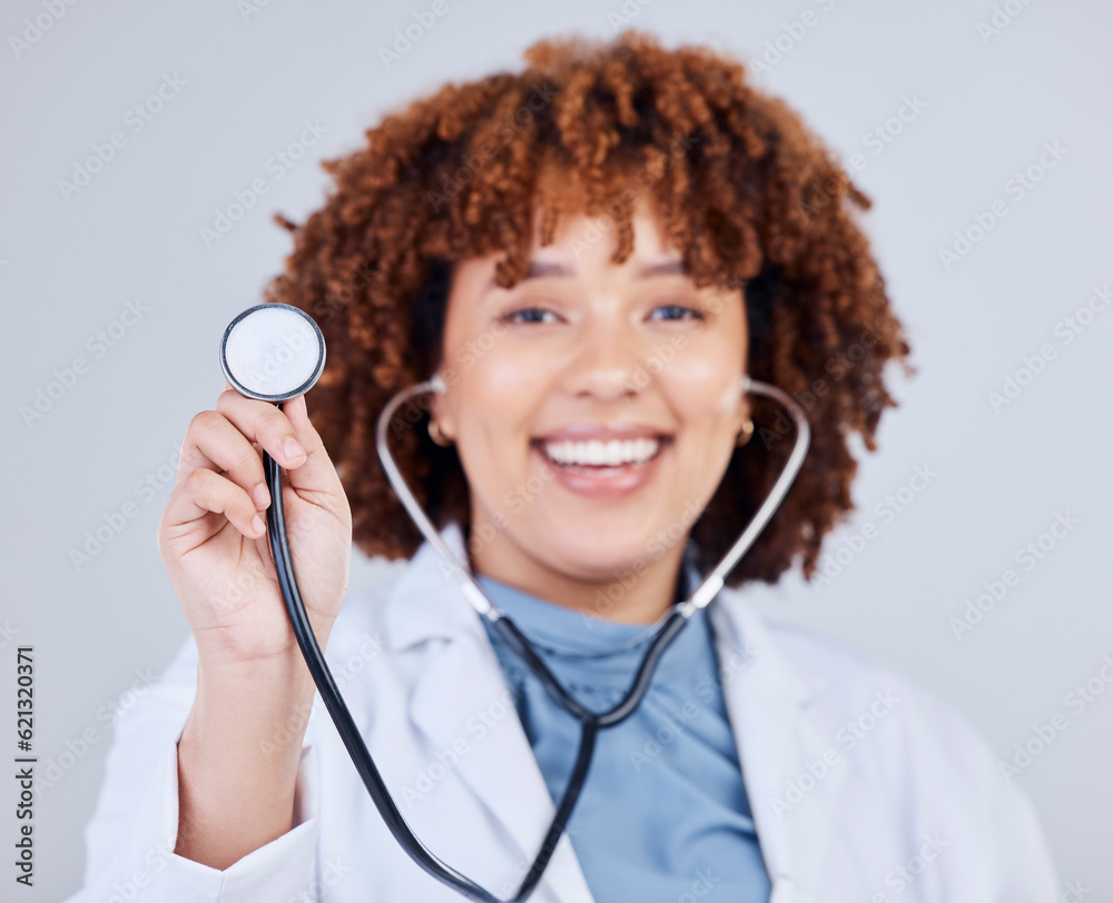 Healthcare, stethoscope and portrait of woman doctor in studio for hospital check up on grey background. Cardiology, health and face of lady cardiologist with heart, lungs and heartbeat medical tool Healthcare, stethoscope and portrait of woman doctor in studio for hospital check up on grey background. Cardiology, health and face of lady cardiologist with heart, lungs and heartbeat medical tool