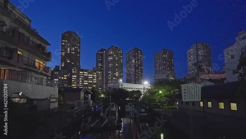 Night light Tokyo, Tsukuda, Toyosu skyscrapers and bridge the Sumida River Yakatabune, pleasure boat