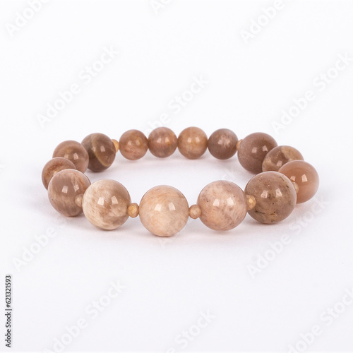 Obraz na płótnie Beige natural stone, Sunstone bracelet. Three different sizes of the stones and small crystals between. w salonie