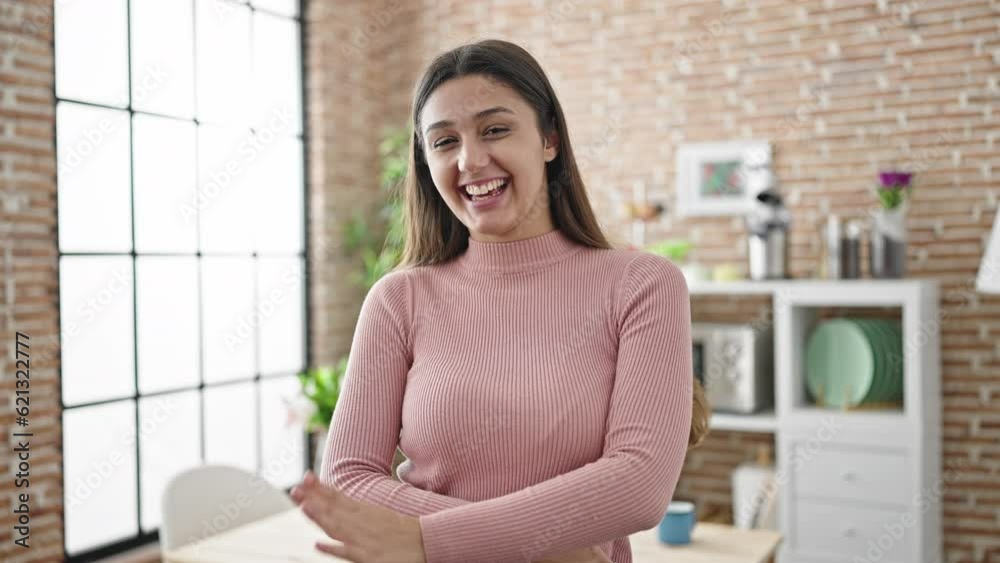 Young beautiful hispanic woman smiling confident dancing at dinning room Young beautiful hispanic woman smiling confident dancing at dinning room