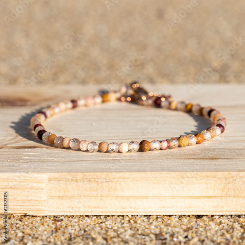 Obraz na płótnie Gemstone small beaded tiny bracelet. Energy crystals, healing stone jewelry. Handmade accessories.
w salonie