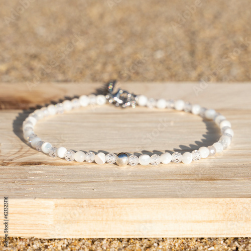 Obraz na płótnie Gemstone small beaded tiny bracelet. Energy crystals, healing stone jewelry. Handmade accessories.
Mother of pearls. w salonie