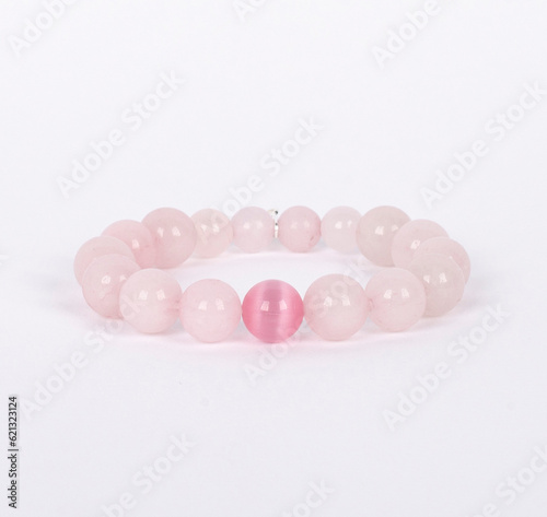 Obraz na płótnie Unique light rose quartz and pink agate bracelet with 925 silver key. w salonie